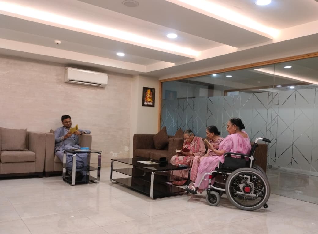 Senior residents participating in a spiritual Gita Path session at Jagriti Dham, a luxurious old age home in Kolkata.