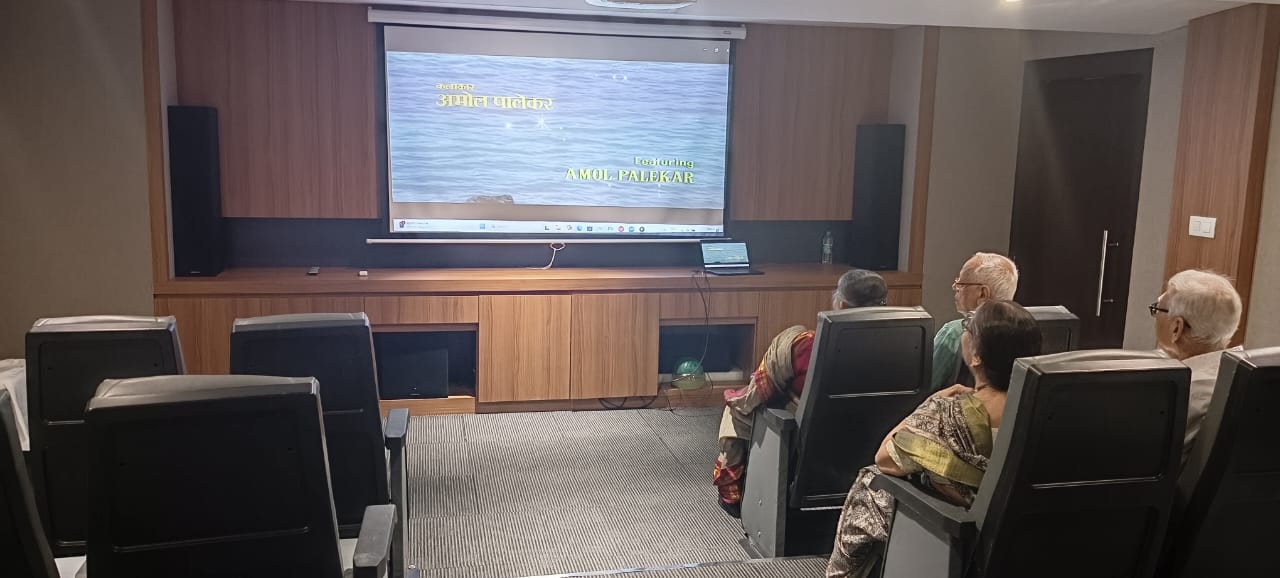 The well-equipped AV room at Jagriti Dham, featuring tiered seating and a large projection screen, provides entertainment for residents at these luxury retirement homes in Kolkata.