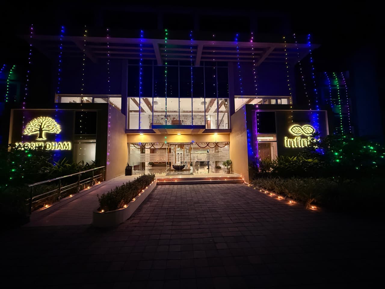 The beautifully illuminated entrance of Jagriti Dham, a luxurious old age home in Kolkata, decorated with colorful lights for Diwali.