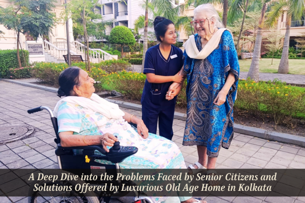 Senior citizens enjoying a stroll with a caregiver in the lush gardens of Jagriti Dham, a luxurious old age home in kolkata offering premium senior living solutions.