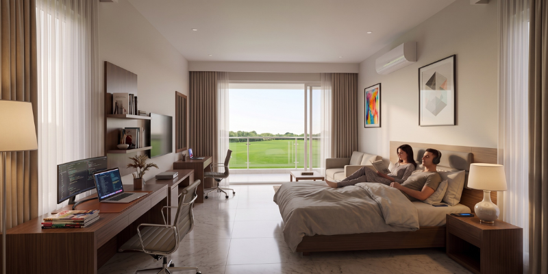 A spacious, modern bedroom suite featuring a large bed, work desk setups, and a balcony view of green lawns.