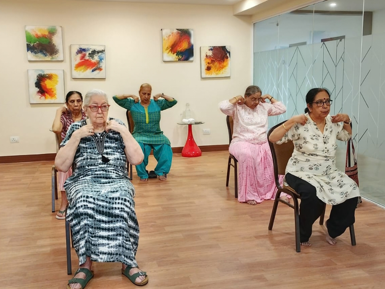 Senior community living with guided group exercise activities