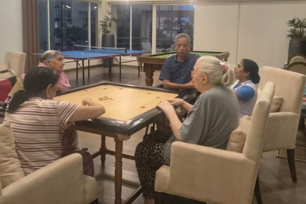 Senior community living with indoor games and social activities